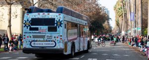 Picture of SacRT holiday Bus traveling down the street